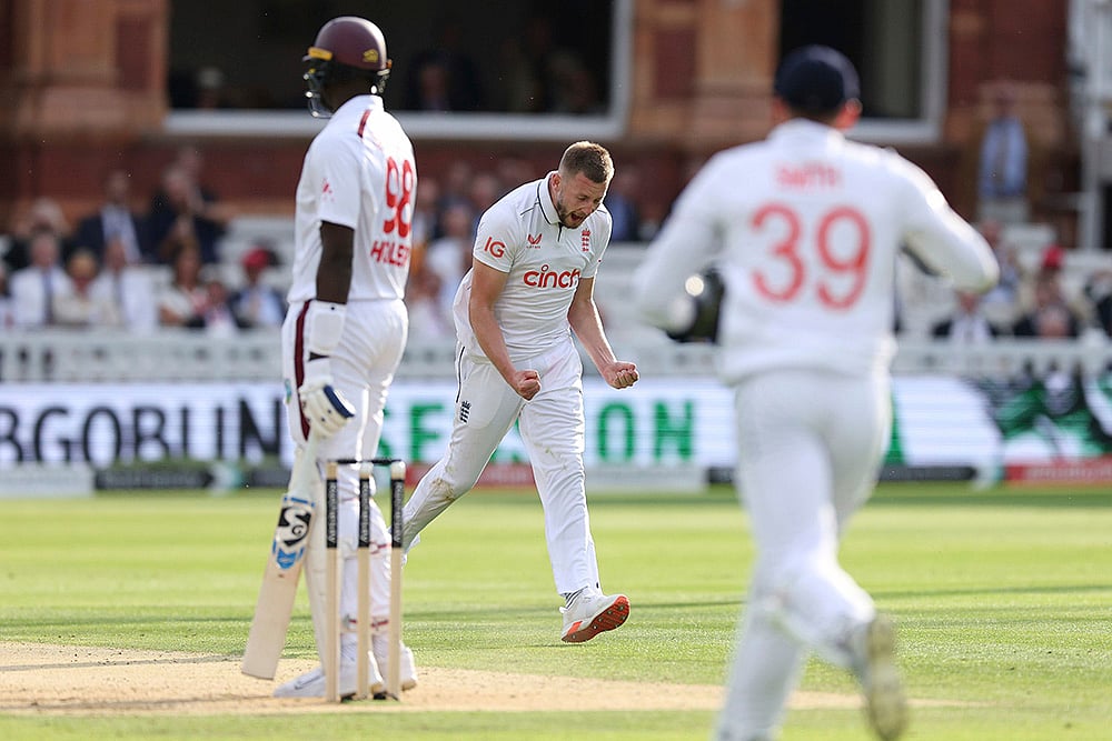 | Photo: Steven Paston/PA via AP : England's Gus Atkinson celebrates wicket of Jason Holder